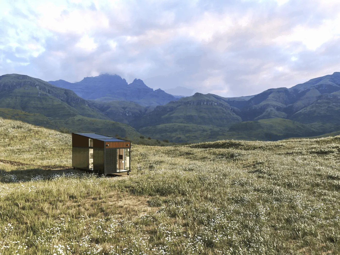 Module Hoummi seul dans une prairie d'altitude, face à un cirque de montagnes